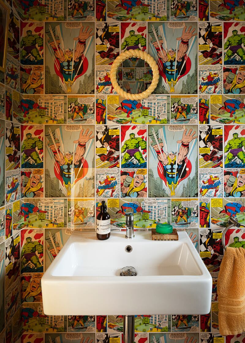 The guest WC is decorated with wallpaper from the 1960s, found online. The same print is papered around the wardrobe area of son Rian’s bedroom