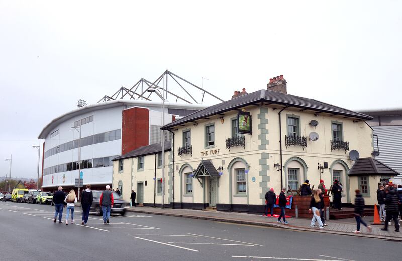 Inside the Turf, it is busy and the barman, Richie Griffiths, is running out of beer. Photograph: Nigel French