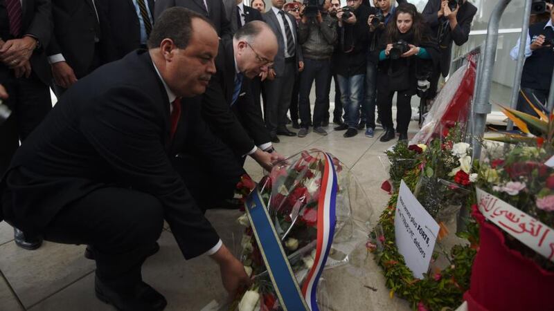 French interior minister Bernard Cazeneuve (second left) and Tunisian interior minister Mohammed Najem Gharsalli (left) lay a wreath at the Bardo Museum on Friday  in Tunis, two days after gunmen attacked the museum. Photograph: EPA