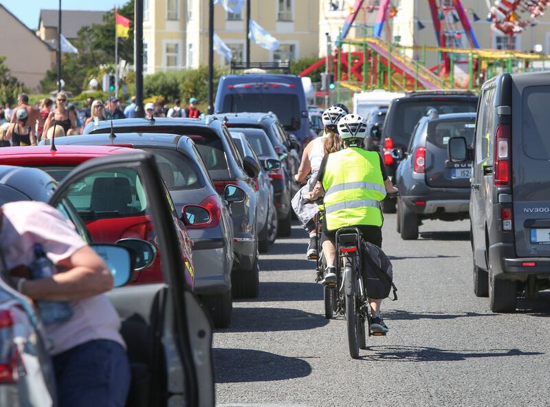 Cyclists in Salthill between traffic and parked cars. Photograph: Joe O'Shaughnessy