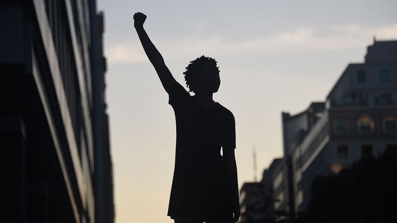 A demonstrator during a protest in Washington DC on Sunday against police brutality and the death of George Floyd. Photograph:  Olivier Douliery/AFP via Getty Images