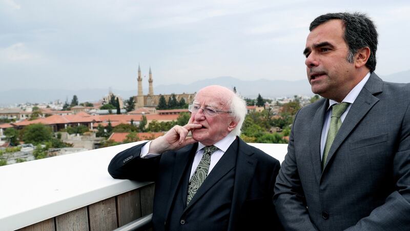 President Michael D Higgins looks over the old city of Nicosia with its mayor, Constantinos Yiorkadjis. Photograph: Maxwells