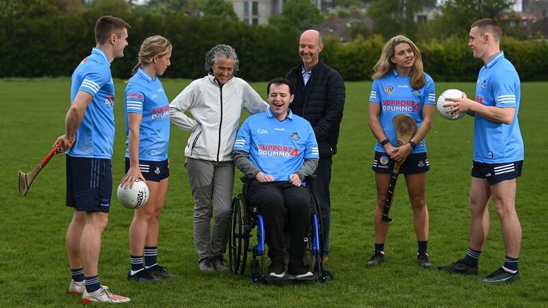 Seán Drummond with his parents Tommy and Jenny and Dublin players, from left, Cian O’Callaghan, Sinéad Wylde, Aisling Maher and Con O’Callaghan at Cuala GAA Club. Photograph: Stephen McCarthy/Sportsfile