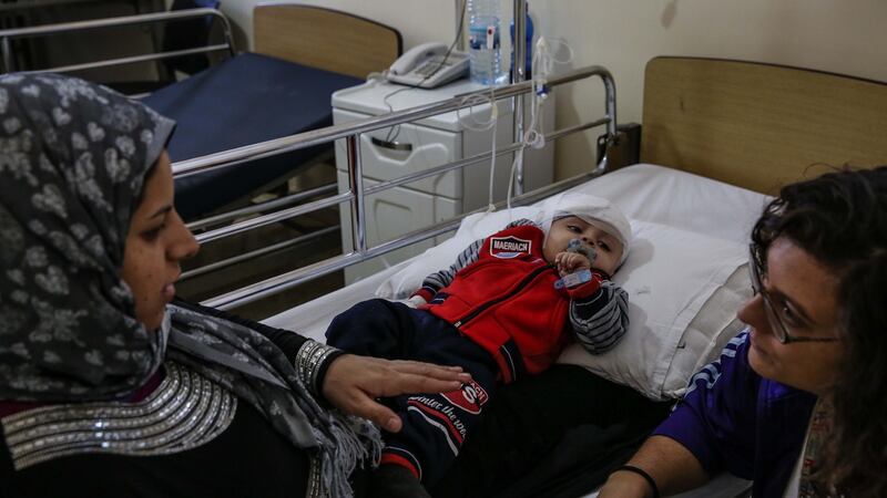 A Syrian boy in a  Chtaura hospital after a shunt was inserted in his head. UNHCR contributed part of the funds for the operation; local charities raised the rest. Photograph: Sally Hayden