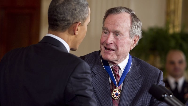 Former US president George HW  Bush is awarded the Presidential Medal of Freedom from US President Barack Obama at the White House in Washington in 2011. Photograph: Bloomberg