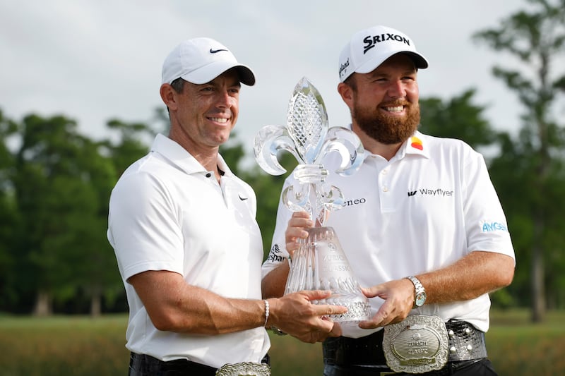 Rory McIlroy and Shane Lowry pose with the trophy after the final round of the Zurich Classic. Photograph: Chris Graythen/Getty Images