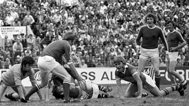 A scramble near the Kerry goalmouth as   Cork’s Denis Allen gains control of the ball in front of a powerless Jimmy Deenihan in the ’1976 Munster football final.