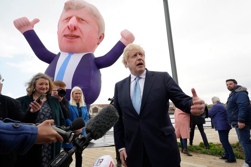 British prime minister Boris Johnson and newly elected MP Jill Mortimer (left) at Jacksons Wharf in Hartlepool, England, following Ms Mortimer’s victory in the Hartlepool parliamentary by-election. Photograph: Owen Humphreys/PA Wire