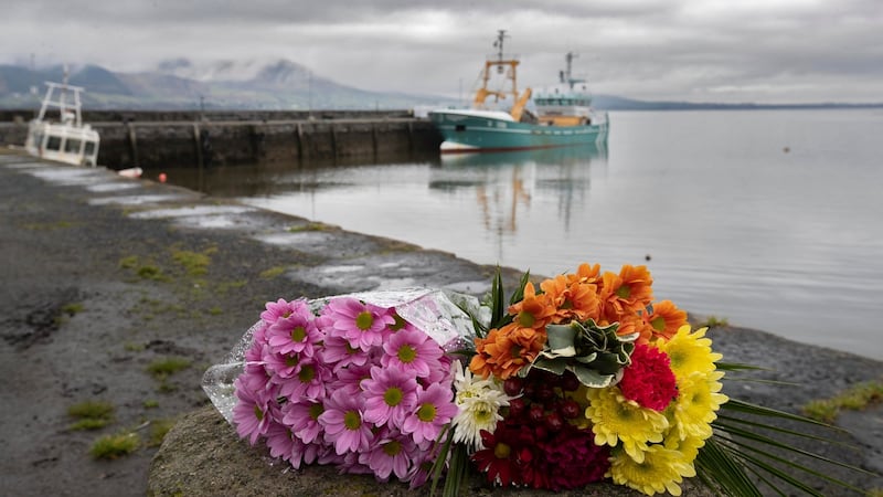 Flowers  placed at Carlingford Lough  in memory of   Ruth Maguire   whose body was recovered  there earlier this month after  she went missing  on  hen night. Photograph:  Colin Keegan/Collins