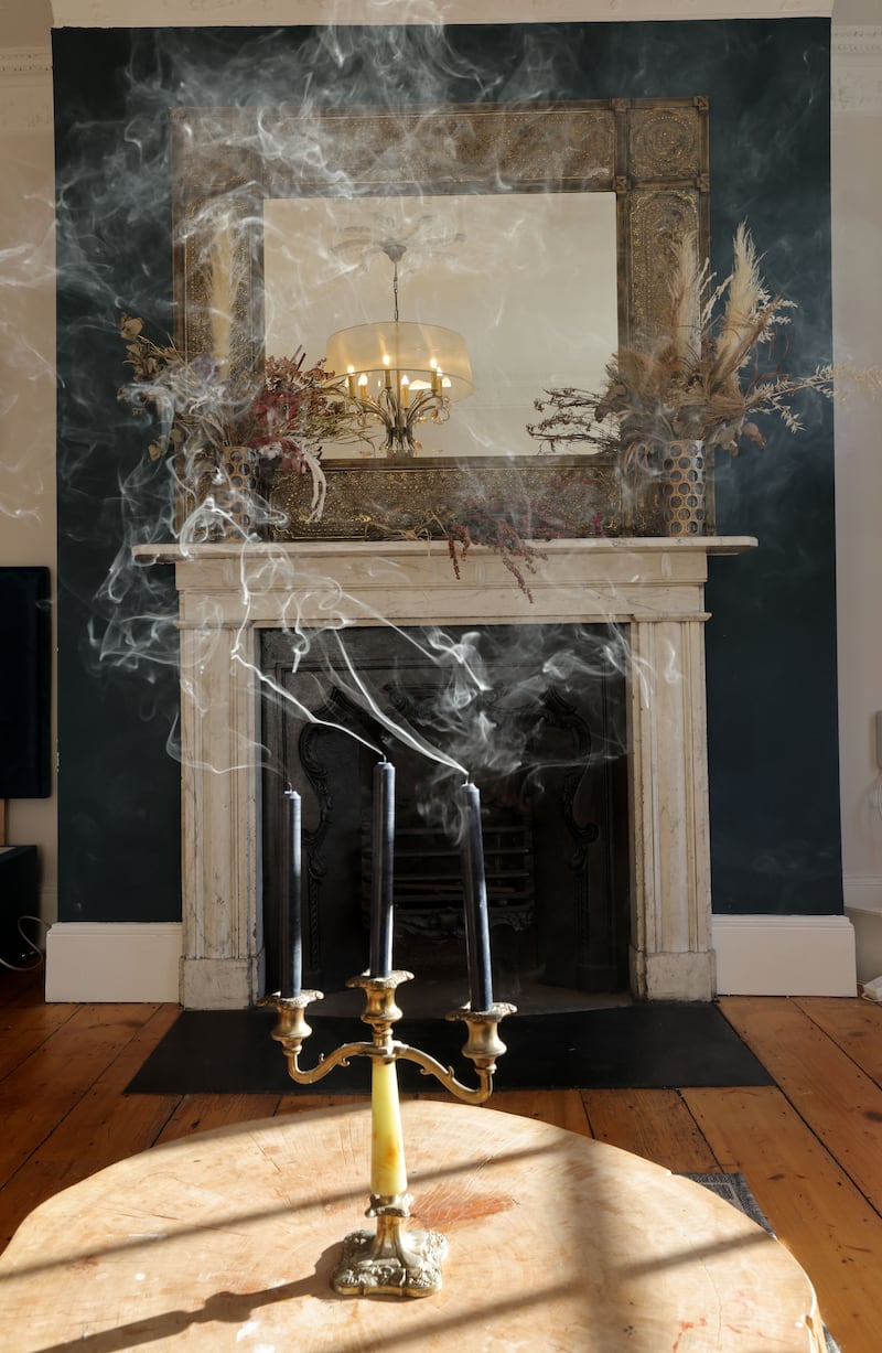 The front room on the piano nobile, said to be Bram Stoker’s bedroom as a child, features its original fireplace and surround. The beaten metal surround mirror and central chandelier are both from Irish design house Mindy Brownes Interiors. The black dinner candles in the candelabra, €1 each, Flying Tiger 