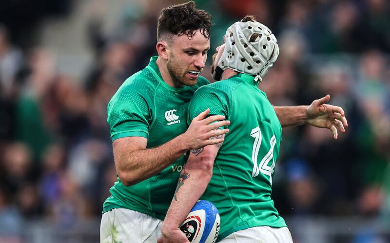 Mack Hansen celebrates scoring Ireland's fifth try with Hugo Keenan during the victory over Italy at the Stadio Olimpico. Photograph: Billy Stickland/Inpho 