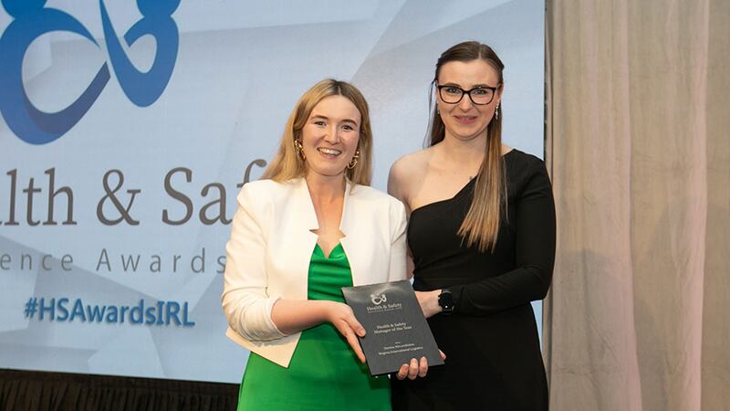 Georgina Groake, customer success executive at FlexManager, presents the Health & Safety Manager of the Year Award to Dorina Alexandrianu, Virginia International Logistics