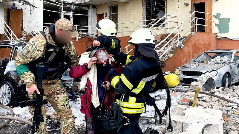 Rescuers carrying a woman out of a damaged building in Odesa, on Saturday. Photograph: State Emergency Service of Ukraine/AFP via Getty Images