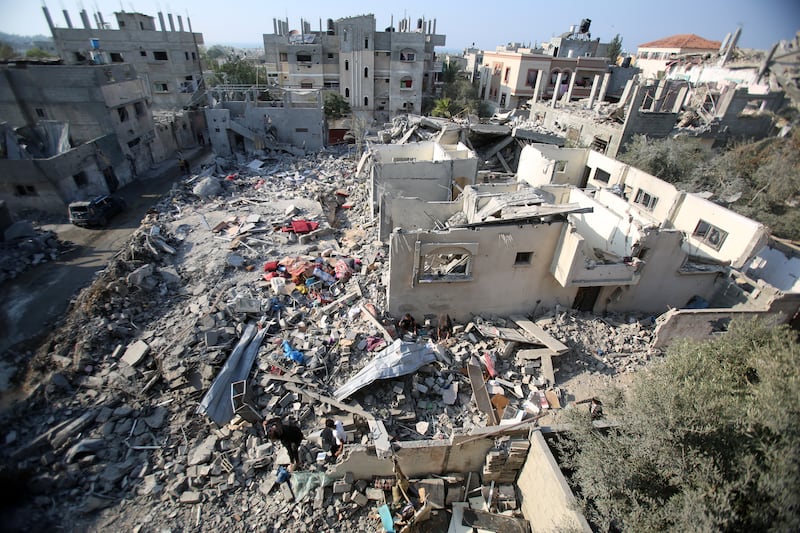 People salvage some belongings amid the rubble of destroyed buildings, following Israeli strikes in Nuseirat refugee camp in the central Gaza Strip on November 7th. Photograph: Eyad Baba/AFP Getty