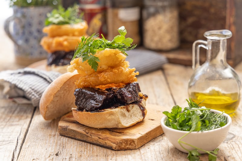 Guinness and treacle glazed beef cheek sliders with crispy fried onions. Photograph: Harry Weir Photography
