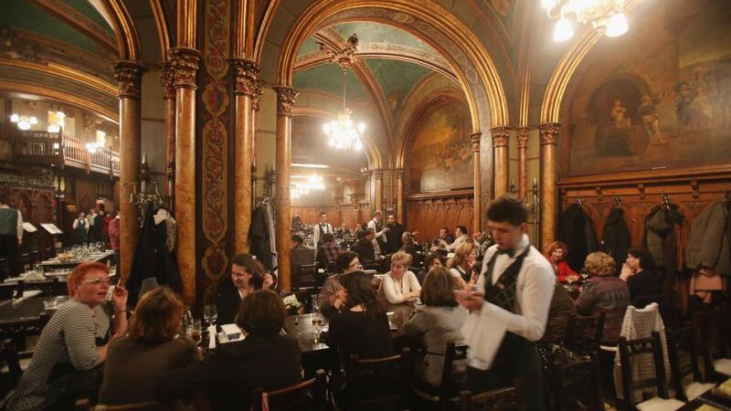 The bustling Caru’ cu Bere (Friends with Beer), the city’s oldest restaurant, opened in 1899. Photograph:  Sean Gallup/Getty Images