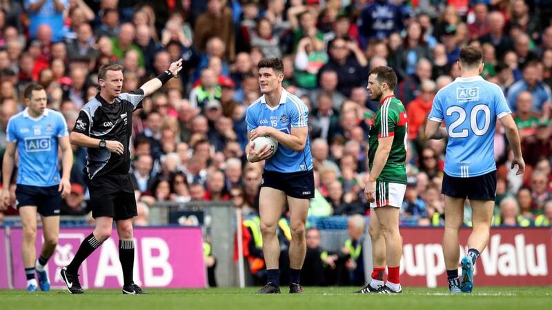 Winning point: Joe McQuillan awards Diarmuid Connolly the late free with which Dublin beat Mayo. Photograph: Ryan Byrne/Inpho