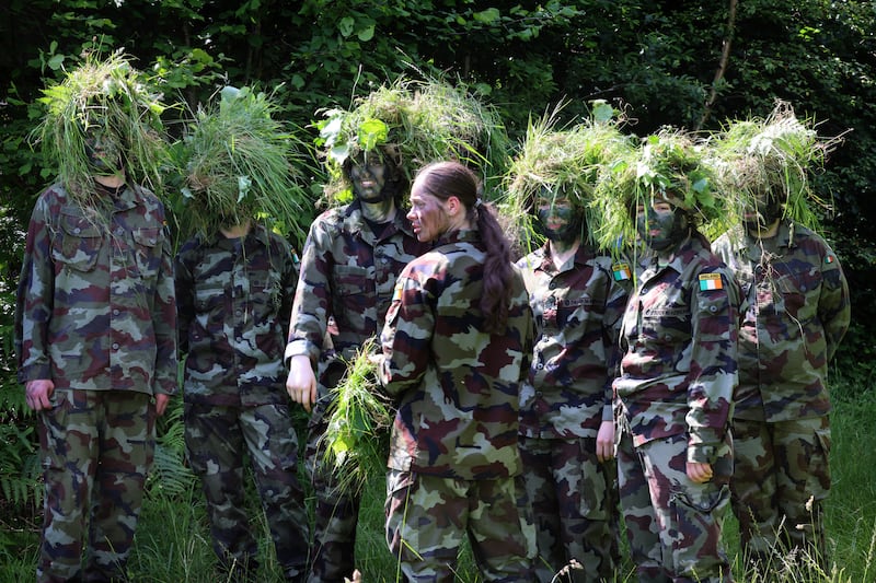 Gaisce Bronze and Silver Award participants taking part in the annual Gaisce Defence Forces Challenge, crossing Lough Rea, in Engineer RHIB, before a demonstration on camouflage and concealment followed by SERE Training, with a demonstration on shelter  construction,  lighting a fire using minimum equipment in a survival scenario, all taking place at the Defence Forces training area at Carnagh East, Co. Roscommon. Photograph: Dara Mac Dónaill / The Irish Times
