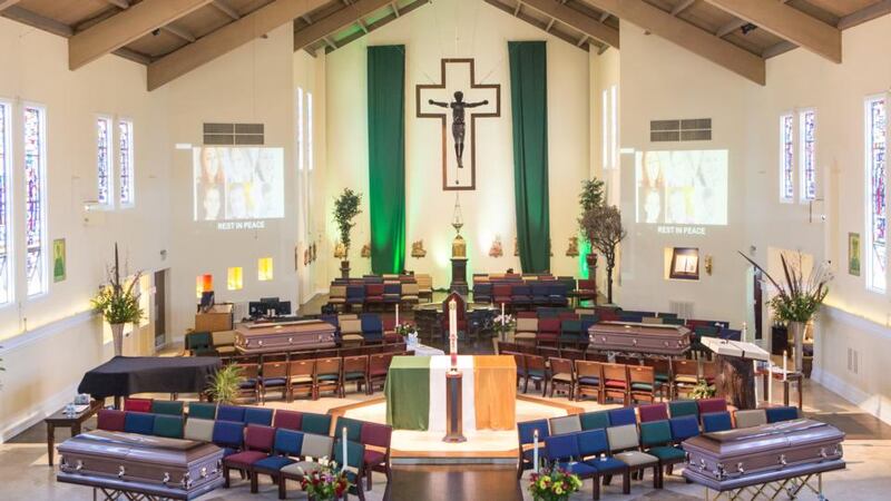 An Irish flag was draped over the altar in the middle of  St Columba Catholic Church in Oakland, where the four coffins (Lorcán Miller (21), Eimear Walsh (21), Eoghan Culligan (21) and Niccolai (Nick) Schuster (21)) were present.   Photograph: Martin Lacey