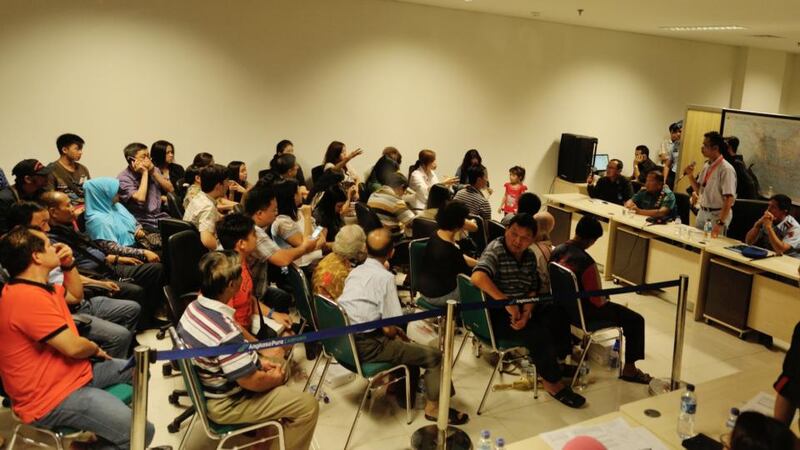 Relatives of missing Air Asia QZ8501 passengers gather during a meeting with officials at the crisis centre of Juanda International Airport Surabaya on Sunday. Photograpg: Getty Images