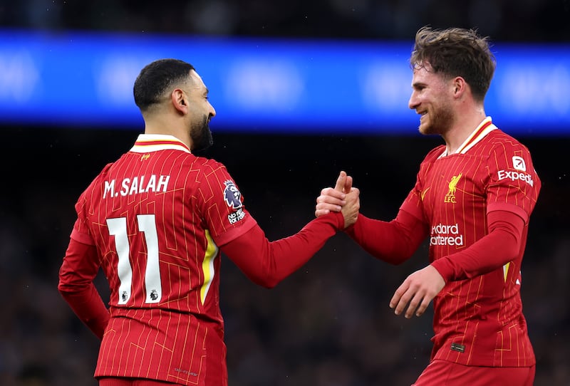 Liverpool's Mohamed Salah celebrates his goal against Manchester City with teammate Alexis Mac Allister. Photograph: Alex Pantling/Getty Images