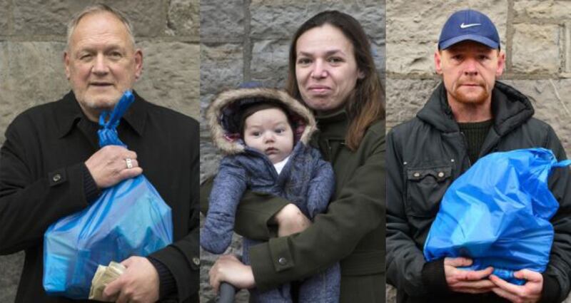 Denis Cowap, Mariana Varvara and her baby Luca, and Stuart Comerford after collecting food parcels from the Capuchin Day Centre, Dublin. Photograph: Dara Mac Dónaill