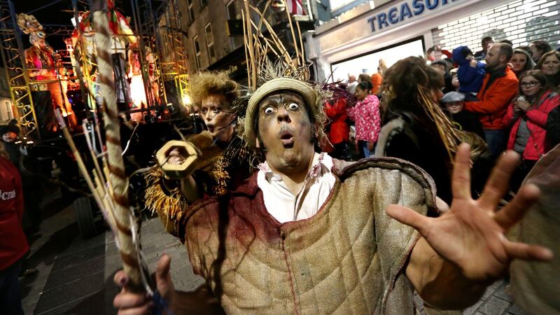 The Macnas Parade, The Shadow Lighter, celebrating the magical, mystical act of transformation, as it passes over the Salmon Weir Bridge in Galway. Photograph: Joe O’Shaughnessy/The Irish Times