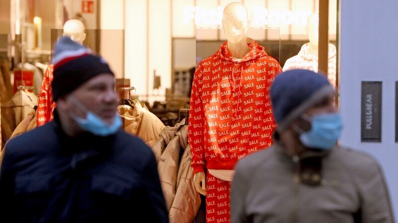 Two men leave a shop on Henry Street in Dublin city centre. Photograph: Brian Lawless/PA Wire