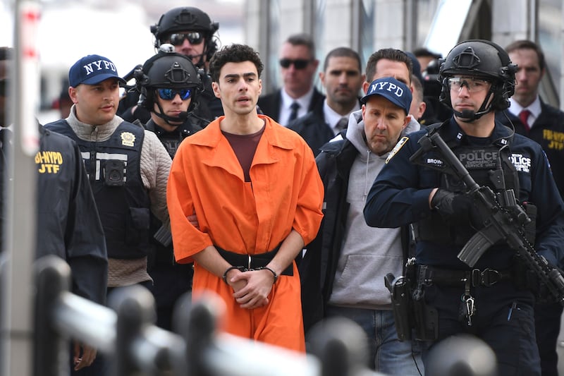 Luigi Mangione, being escorted by police, in New York on December 19th. Photograph: Pamela Smith/AP