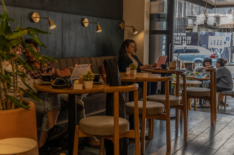 People working remotely in a cafe in the Condesa neighbourhood of Mexico City. Photograph: Alejandro Cegarra/New York Times