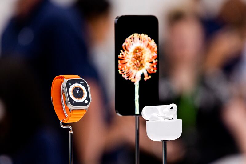 The new iPhone is displayed alongside the Apple Watch Ultra and AirPod Pros during the launch event in Cupertino, California, on Wednesday. Photograph: Getty Images