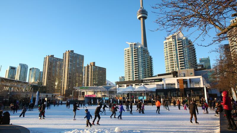 Toronto, Canada. Harbourfront with downtown Toronto buildings and CN Tower in the background. Winter leisure time in downtown Toronto. Visit a freind from €359 return for Christmas.