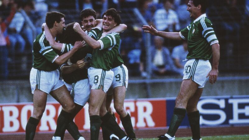 Ronnie Whelan is mobbed by  Republic of Ireland team-mates after  scoring a superb goal against the USSR during the  European Championship clash in Hannover in 1988. Photograph:  Billy Stickland/Allsport/Getty Images