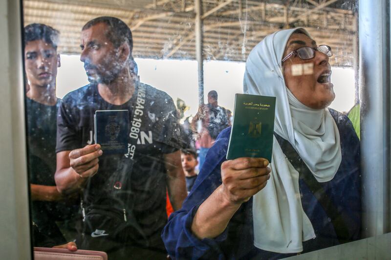 Israel-Hamas conflict: People waiting to see if they will be allowed to cross the into Egypt from Gaza. Photograph: Samar Abu Elouf/The New York Times