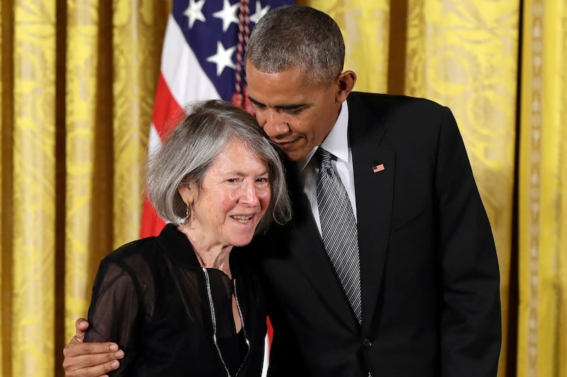 Former US president Barack Obama embraces poet Louise Glück before awarding her the 2015 National Humanities Medal at the White House in 2016. Photograph: Carolyn Kaster/AP/PA