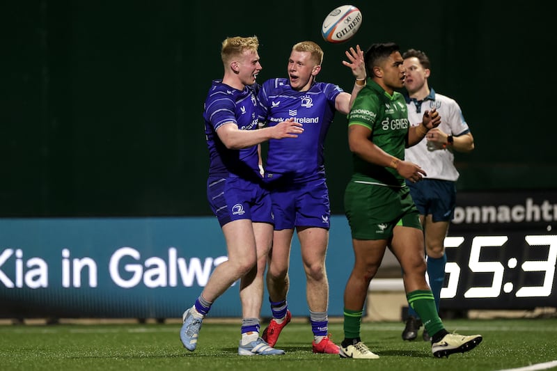 Leinster's Andrew Osborne celebrates scoring a try with his brother Jamie. Photograph: Laszlo Geczo/Inpho 