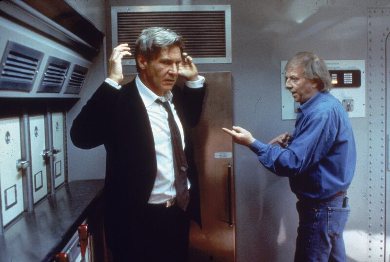 Air Force One: Wolfgang Petersen directs Harrison Ford on the set of the film. Photograph: Columbia/Fotos International/Getty