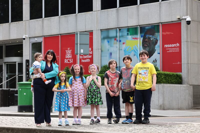 Rosemary Murphy outside the RCSI earlier this year with seven of her 12 children - Dion, Maeve, Lara, Britney, Skyler, Cody and Finn. Photograph: Dara Mac Dónaill