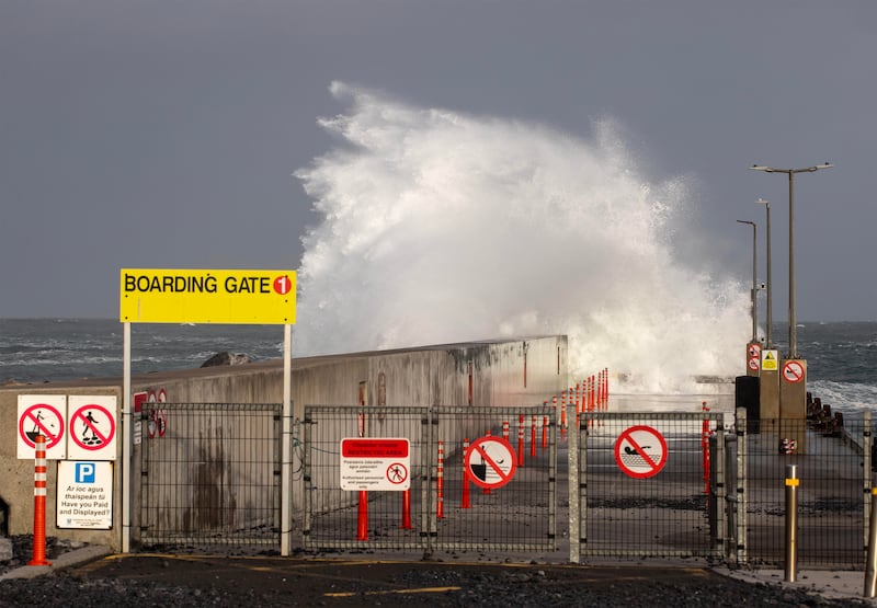 A wave crashes over main pier at Doolin in Co Clare as Storm Ashley makes landfall. Ferries from Doolin to the Aran Islands were cancelled as a result of the storm. Photograph: Press 22