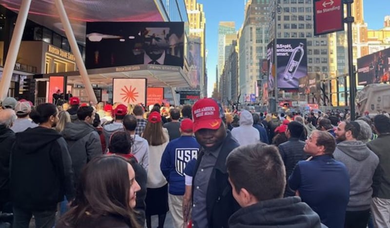 Trump supporters watch the Republican candidate's Madison Square Garden speech on a big screen. Photograph: Keith Duggan