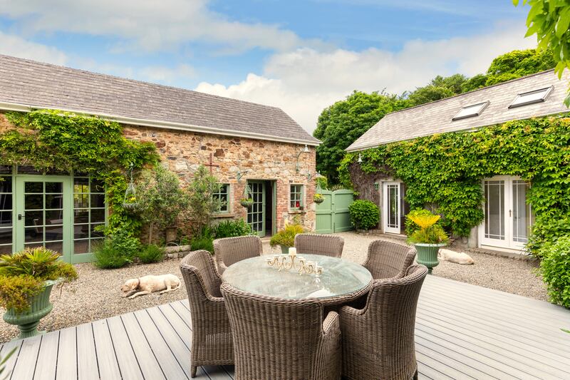 A courtyard lies to the rear of the house