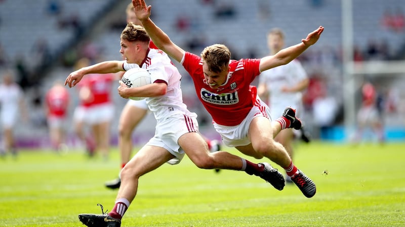 Galway’s Daniel Cox and Daniel Peet of Cork in action during the minor final. Photograph: Ryan Byrne/Inpho