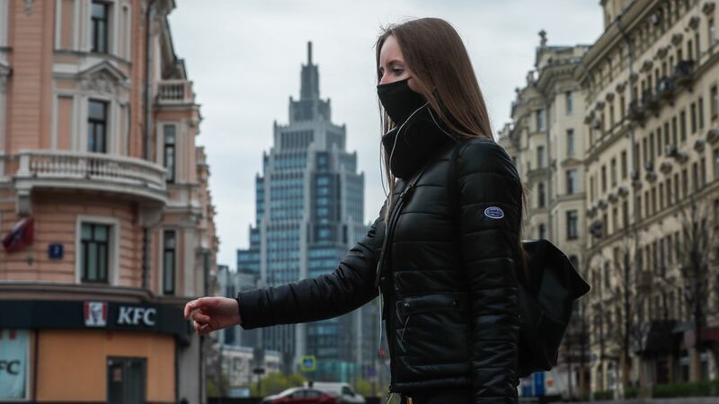 A woman  in downtown Moscow on Monday. Photograph: Yuri Kochetkov/EPA