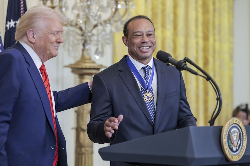 US president Donald Trump with golfer Tiger Woods. Photograph: Shawn Thew/POOL