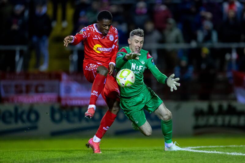 Drogheda goalkeeper Luke Dennison and Shelbourne’s Mipo Odubeko playing in the President's Cup. Photograph: Morgan Treacy/Inpho