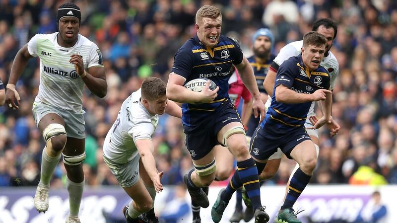 Dan Leavy runs in a try despite the efforts from Owen Farrell of Saracens Photograph: Tommy Dickson/Inpho