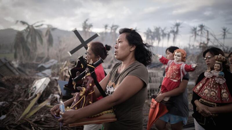 First Prize Spot News Single by Philippe Lopez of France, for Agence France-Presse, November 18th, 2013, in Tolosa, the Philippines. Survivors of typhoon Haiyan march during a religious procession on the eastern island of Leyte. Haiyan left 8,000 people dead and missing and more than four million homeless after it hit the central Philippines.