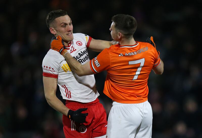 Tension rises between Tyrone's Conn Kilpatrick and Greg McCabe of Armagh. Photograph: Leah Scholes/Inpho