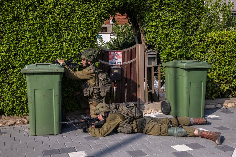 Israeli soldiers patrol a residential neighbourhood of Sderot, Israel, a city near Gaza attacked by Hamas gunmen. Photograph: Tamir Kalifa/The New York Times