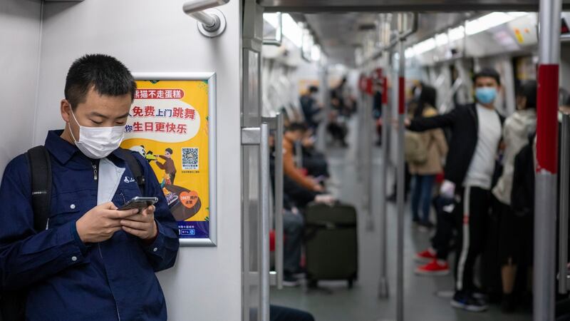 Passengers wear face masks on a subway train in Guangzhou, Guangdong province. Photograph: Alex Plavevski/EPA